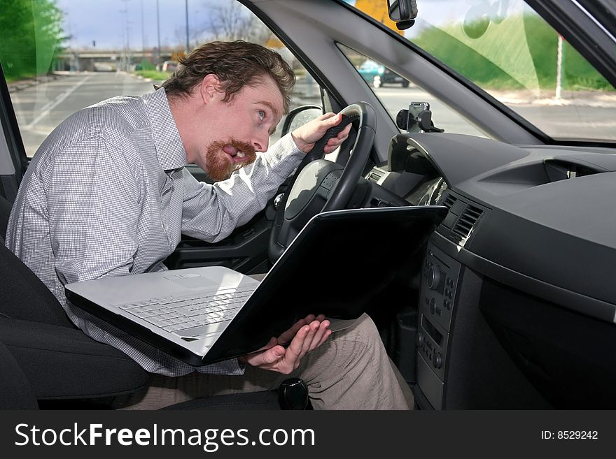 Driver using GPS laptop computer in a car