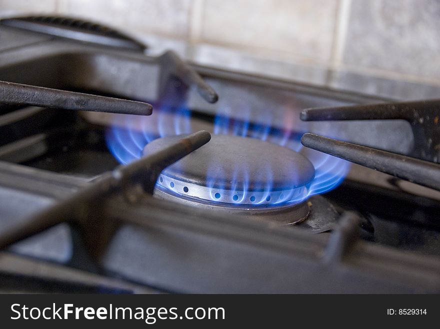 Gas stove ring with flames