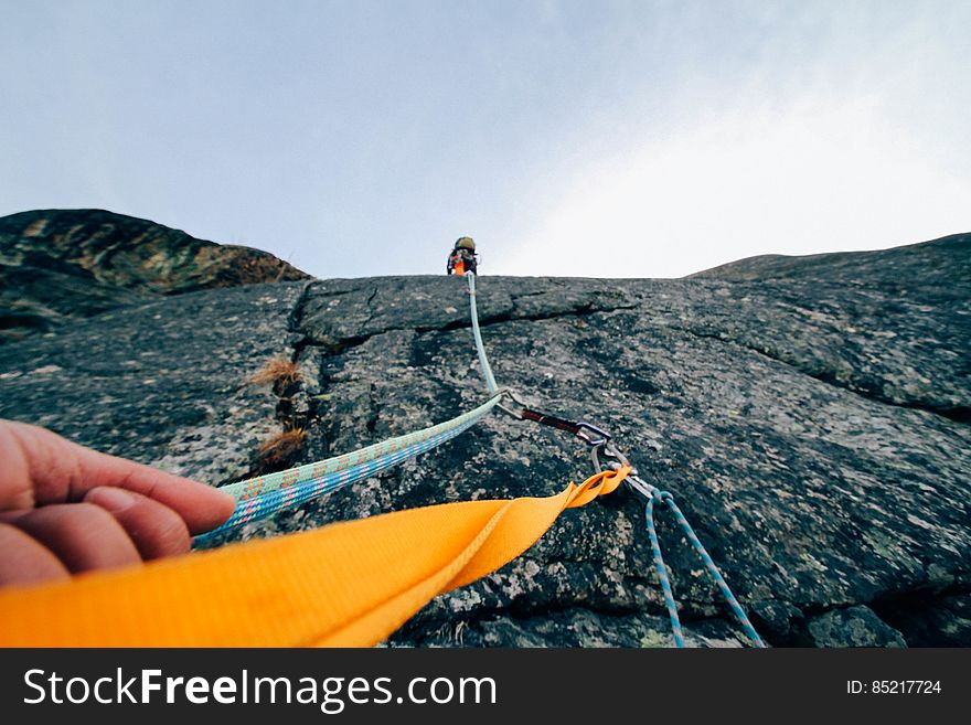 Climber Hanging From Rope