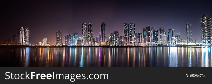 Panoramic View Of City Lit Up At Night