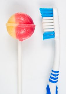 Tooth Brush With Colored Candy Royalty Free Stock Photo