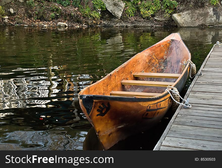 Native American canoe at dock.