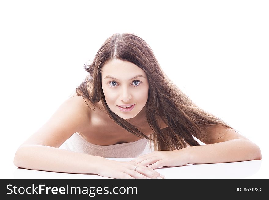 High key portrait of young woman on white back