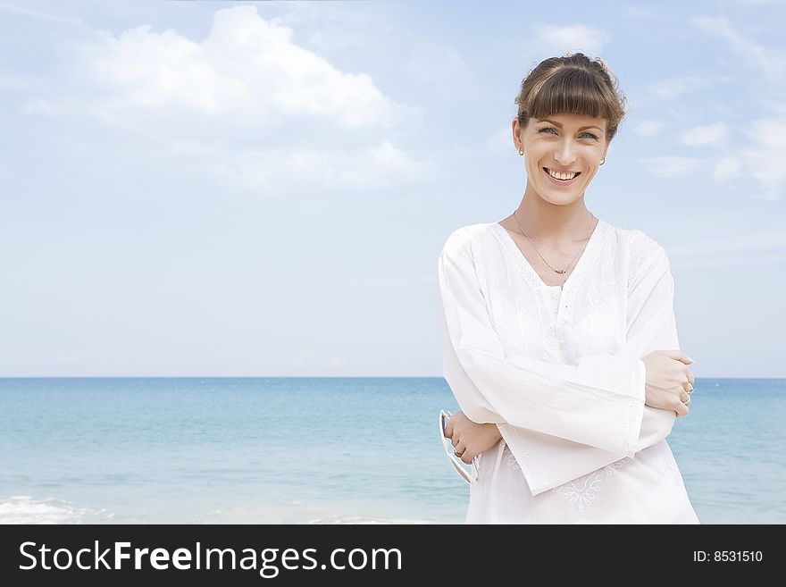 Portrait of nice young woman having good time on the beach. Portrait of nice young woman having good time on the beach