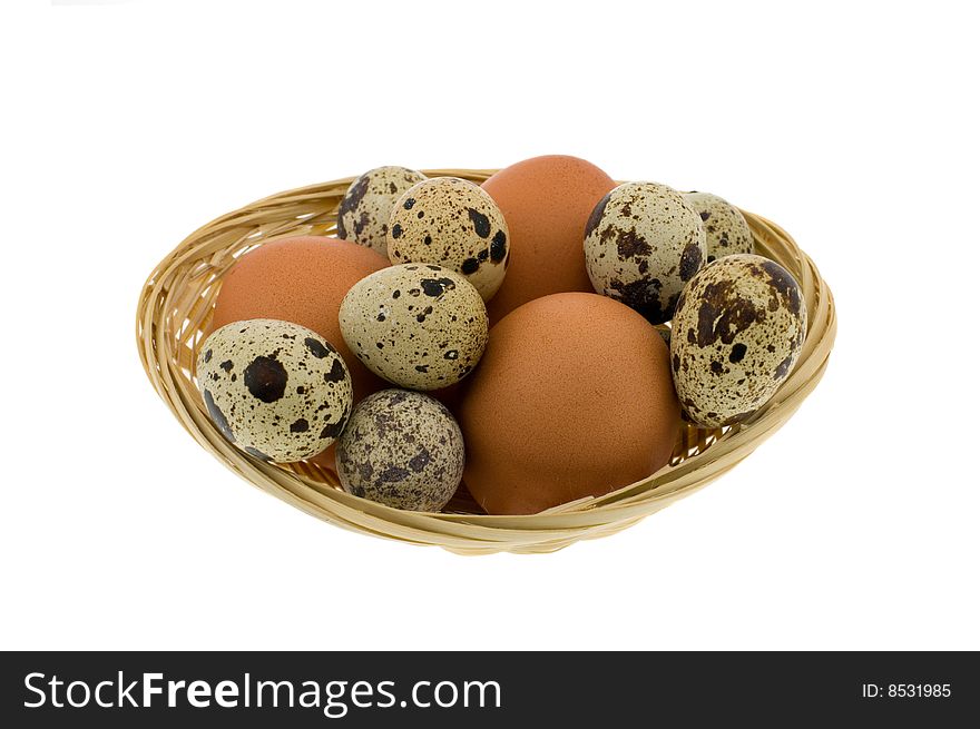 Crude eggs in basket isolated on a white background