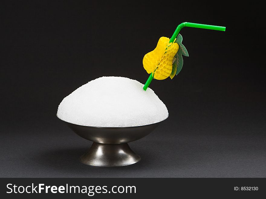 Snow in a cup for ice-cream isolated on a black background. Snow in a cup for ice-cream isolated on a black background