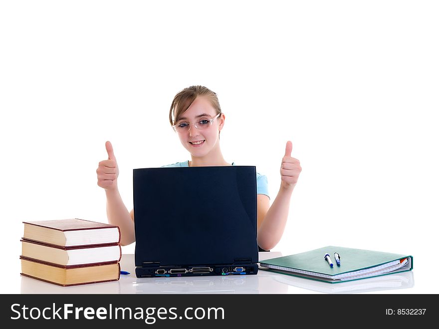 Happy smiling teenager girl on desk doing studying and homework