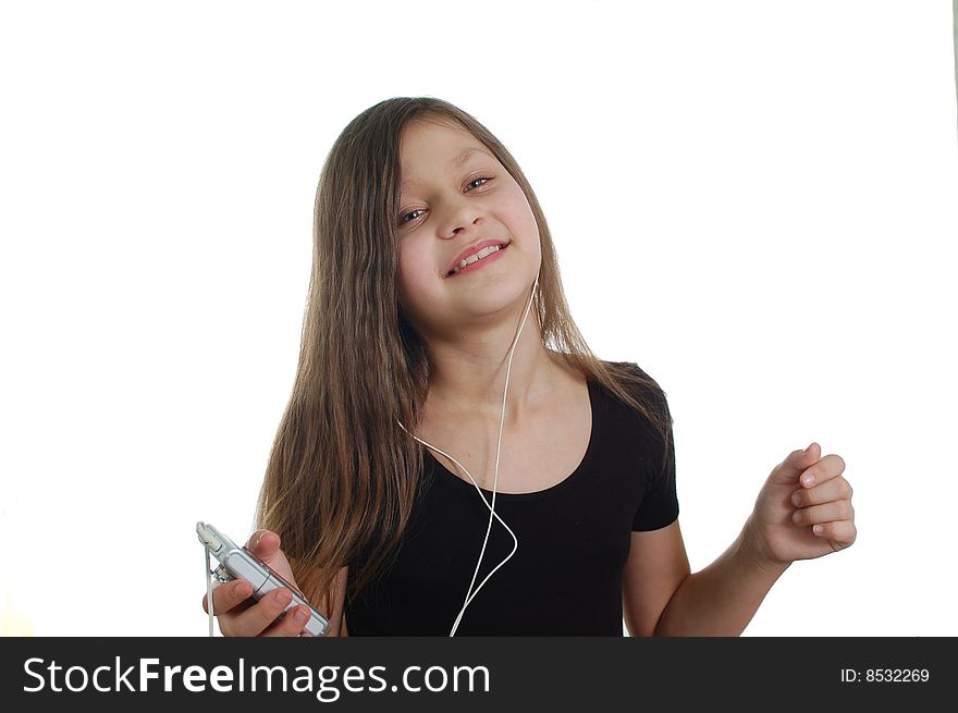 The little cute girl listen the music(holding the pleer )