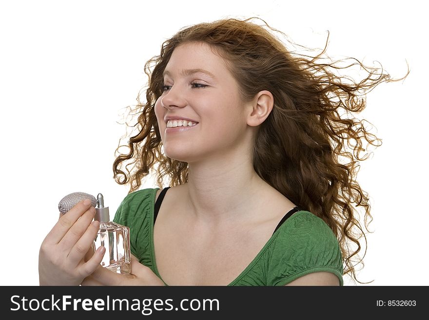 Red haired teenager with perfume, pleasant smell for the personal hygiene