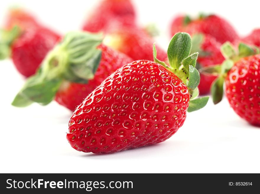 Fresh strawberries isolated on white background - close up