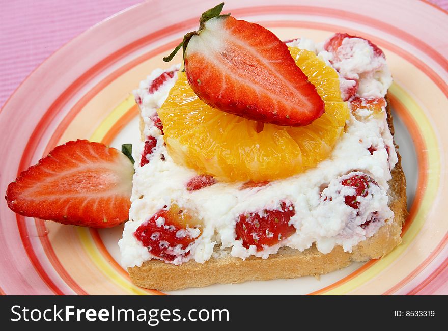 Sandwich with cheese and fruit on plate