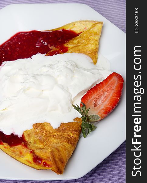 Pancake with fruit and cream
