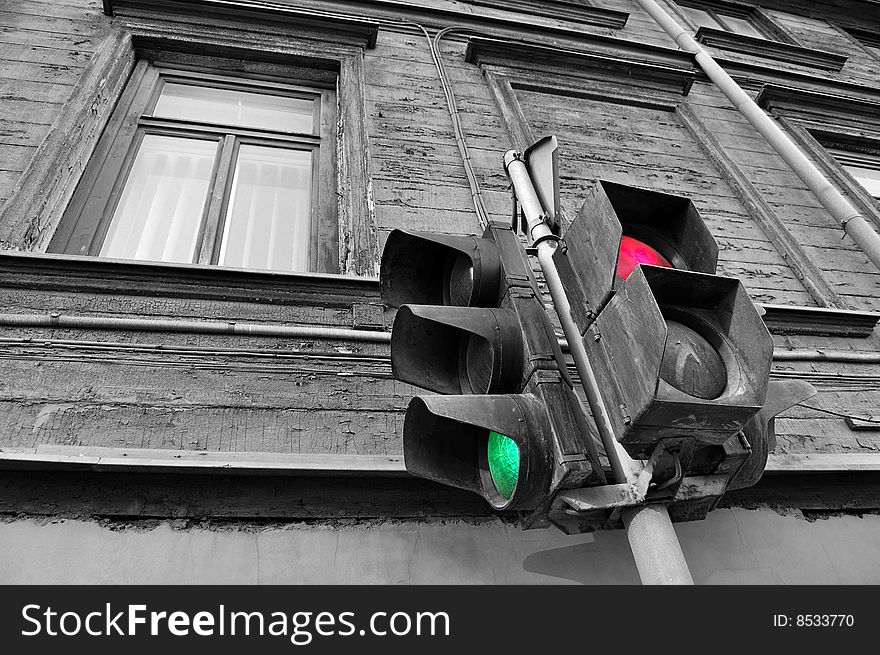 Traffic light on a facade of an old building. Traffic light on a facade of an old building.