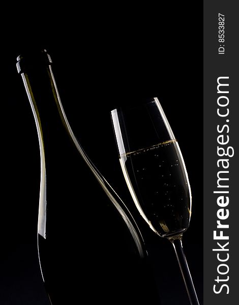 Champagne glass on black background