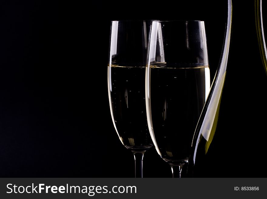 Champagne glass on black background