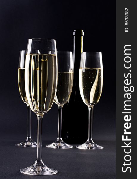 Champagne glass on black background