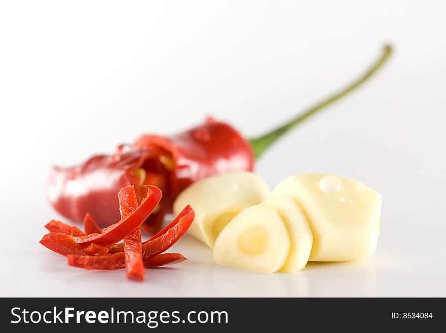 Red Chili and gralic slice on white background. Red Chili and gralic slice on white background.