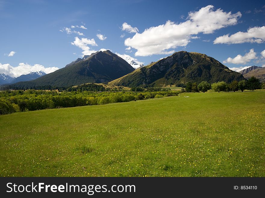 Spring Landscape Green Meadow with Mountains. Spring Landscape Green Meadow with Mountains