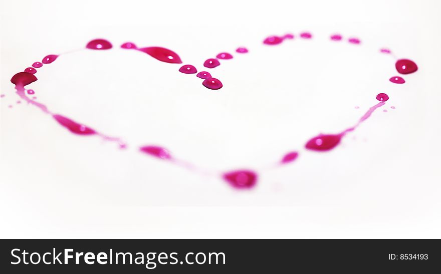 Pink heart made of water drops