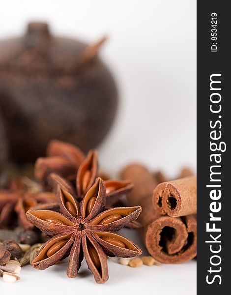 Spices & wooden jars. focus on star anise.