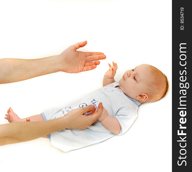 Baby and parent's hands over white