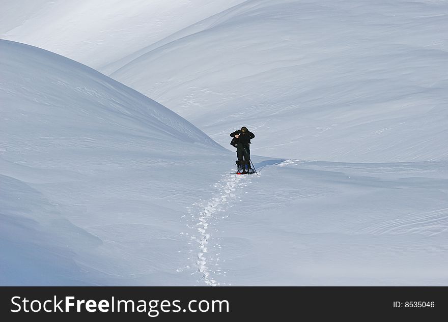 Woman mountainering alone in snow