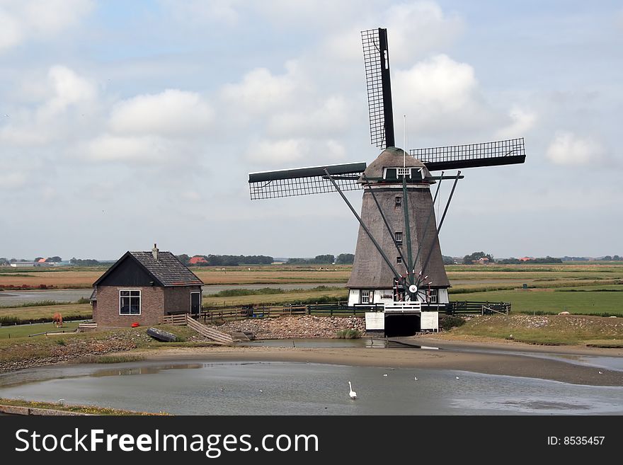 Landscape of Texel Island, in the Netherlands  an old windmill. Landscape of Texel Island, in the Netherlands  an old windmill.