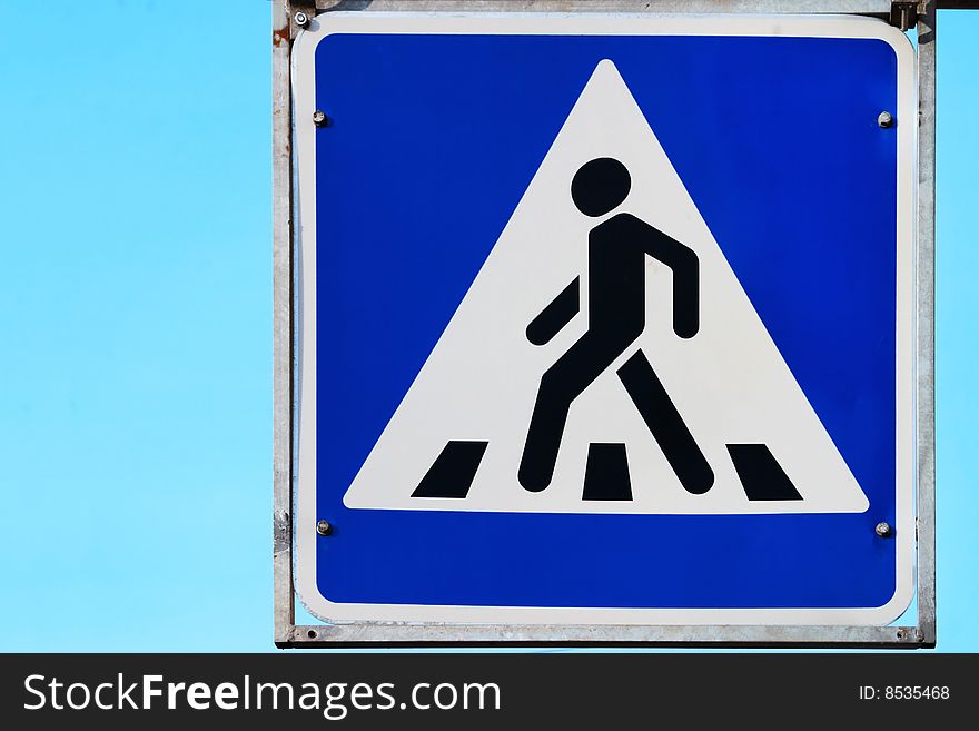 Road Sign On Pedestrian Crossing