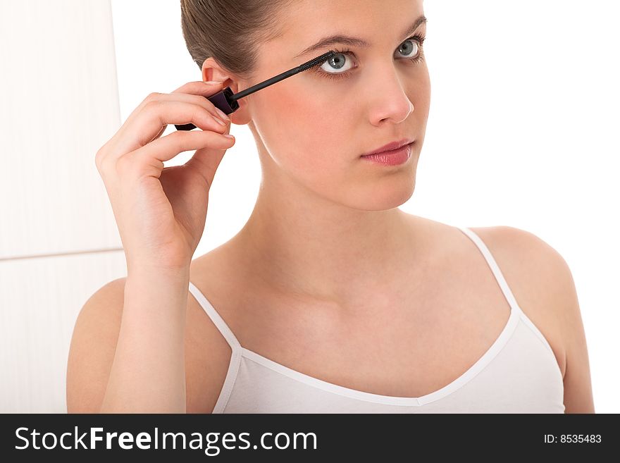Body care - Young woman apply mascara