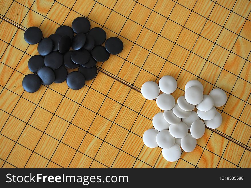 Chinese Go board with black and white pieces