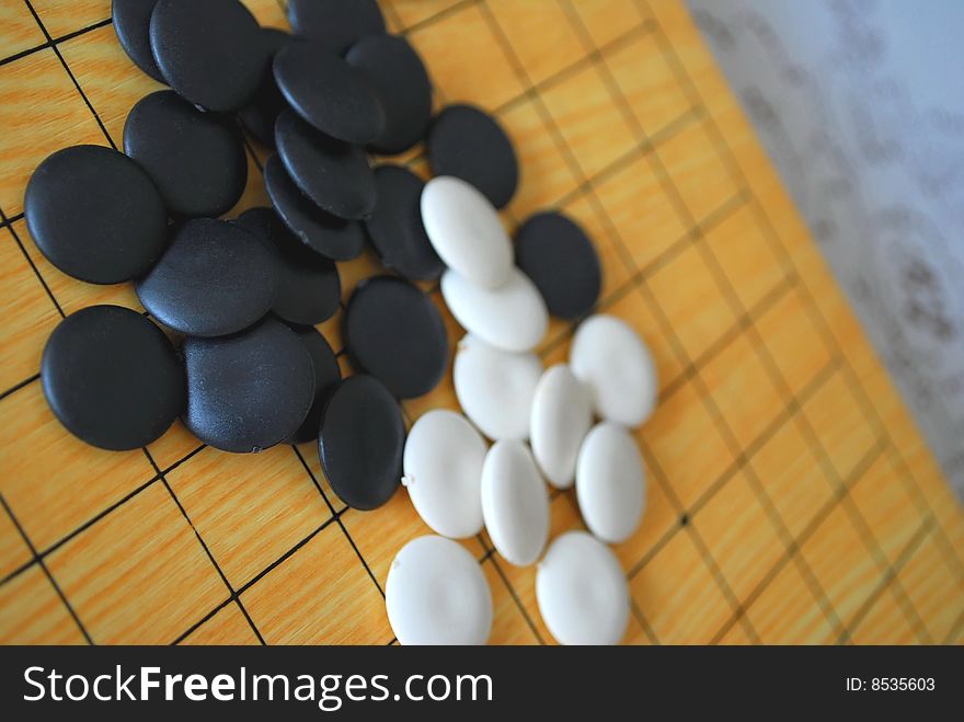 Chinese Go board with black and white pieces