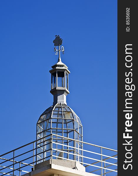 Vintage lighthouse dome with beautiful weathercock, Lisbon, Portugal