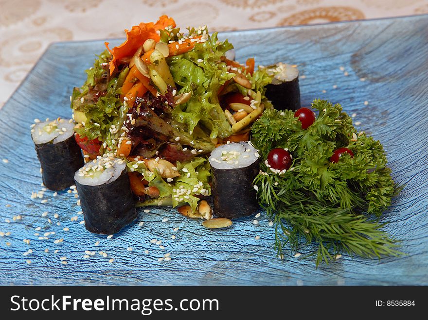 Spring salad from fresh vegetables with rice beaters