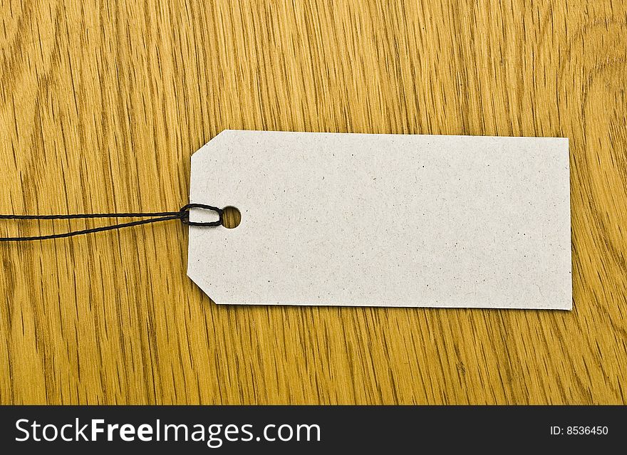 Blank tag on wooden background