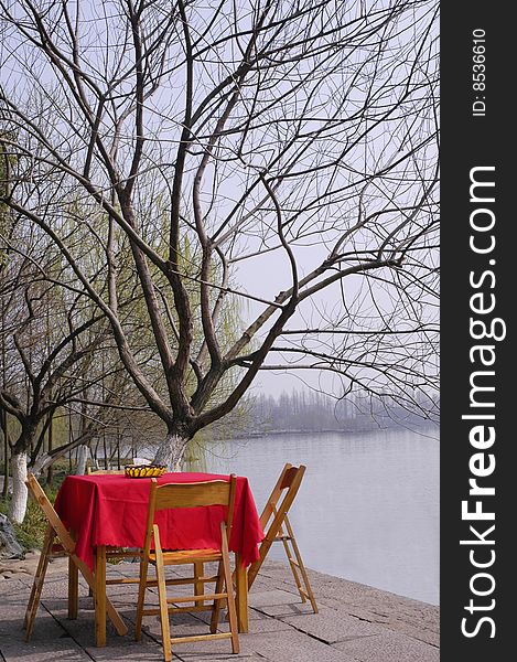 The Desk And Tree On Waterside