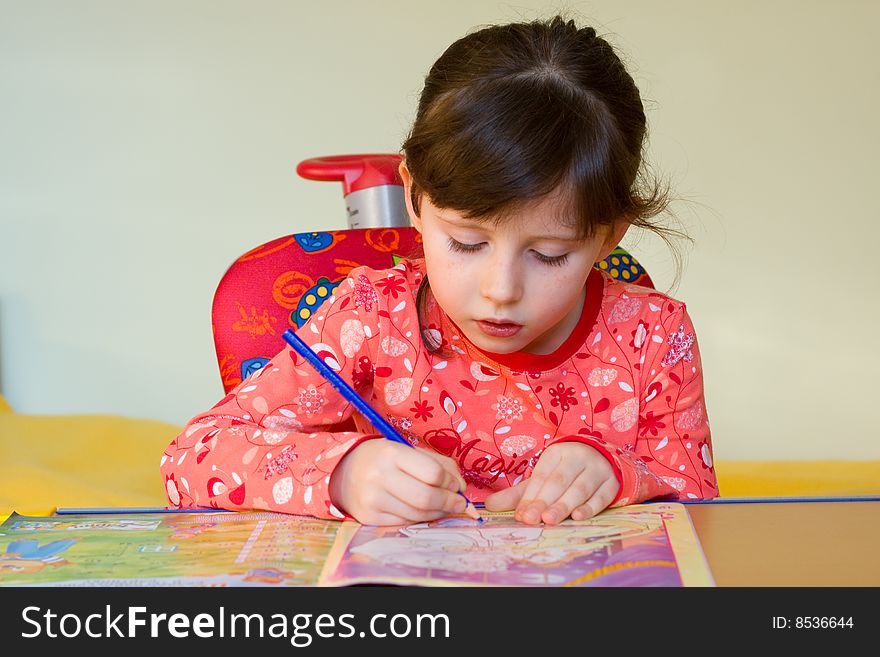 Cute 5 years old girl drawing