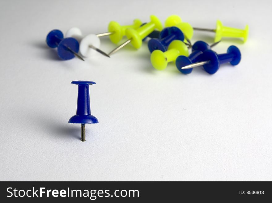 Plastic colored tacks isolated on white background. Plastic colored tacks isolated on white background