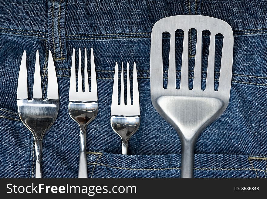 Background jeans with kitchen utensil