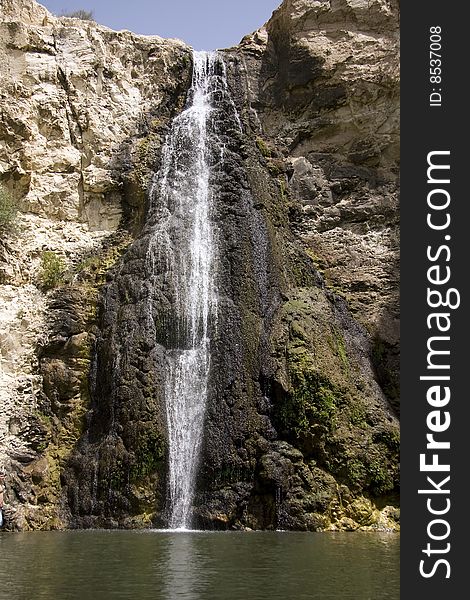 White waterfall over black rocks