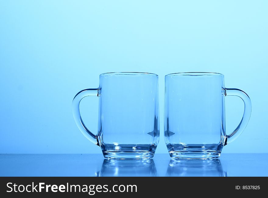 An empty glass in blue background.