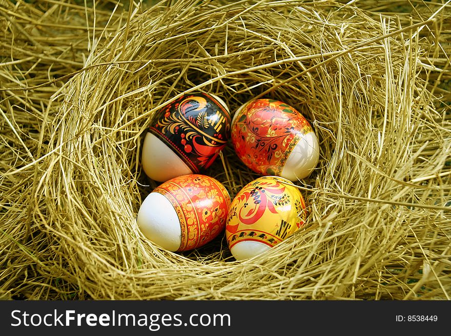 Four Easter eggs lie in a nest. Four Easter eggs lie in a nest