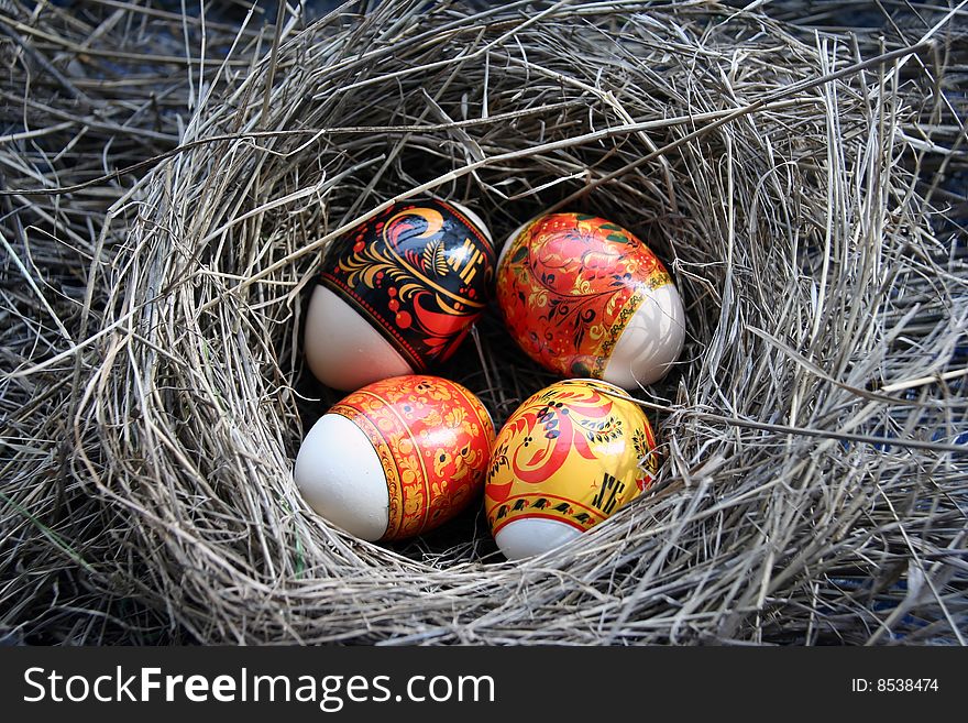 Four Easter eggs lie in a nest. Four Easter eggs lie in a nest