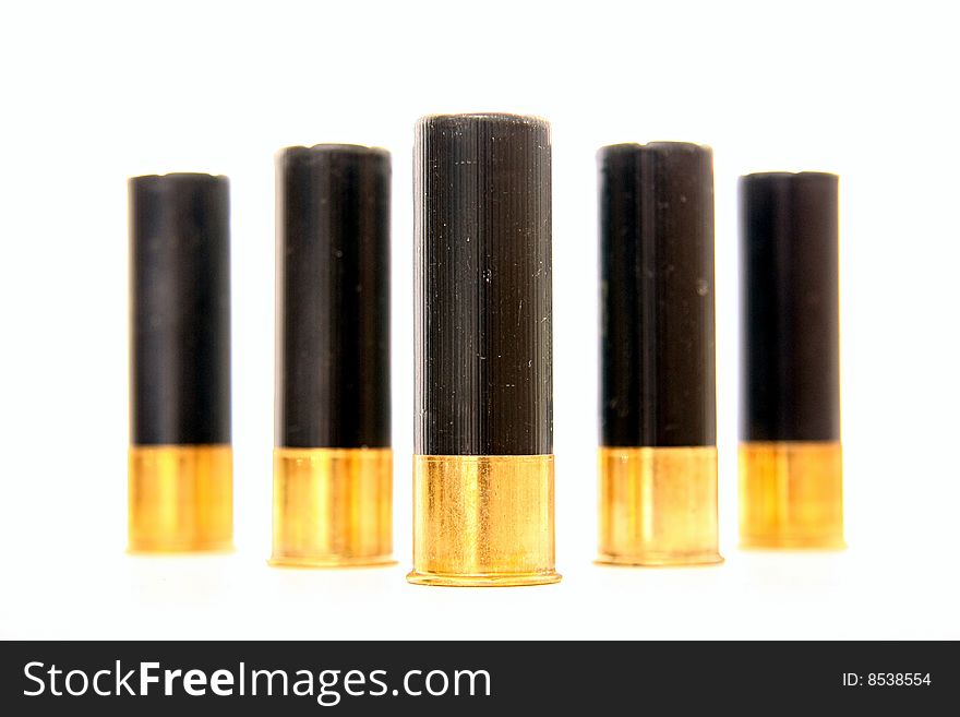 Black and gold shot-gun shells isolated on white