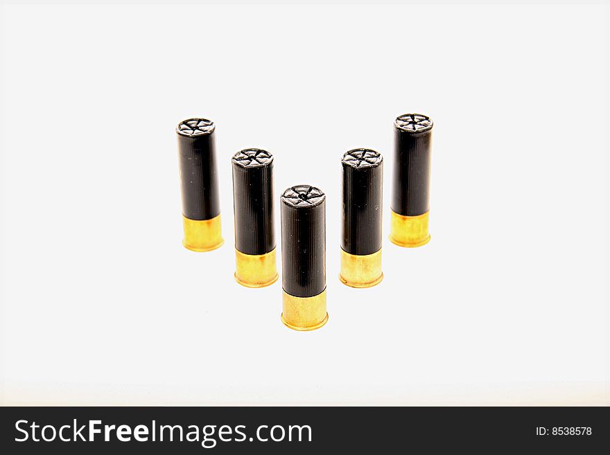 Black and gold shot-gun shells isolated on white