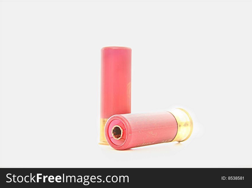 Red and gold shot-gun shells isolated on white