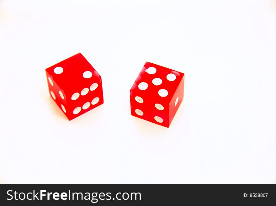 Two red clear dice isolated on white with seven showing. Two red clear dice isolated on white with seven showing
