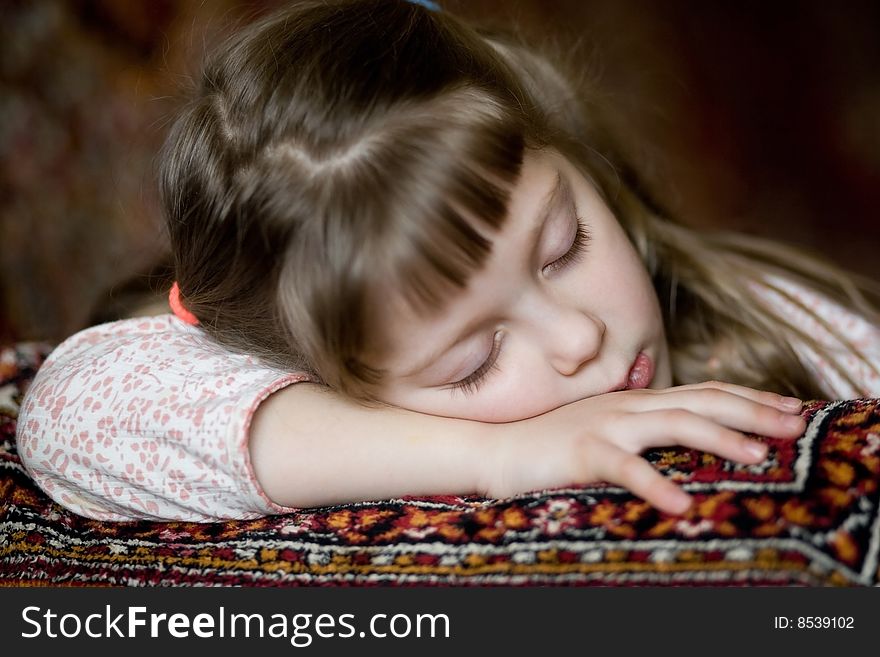 Stock photo: an image of a beautiful sleeping girl on a sofa
