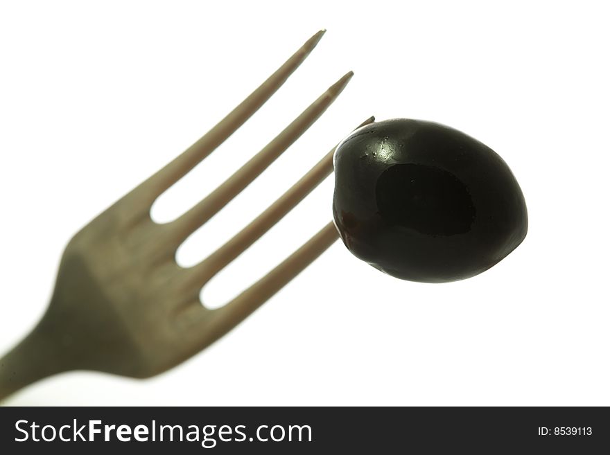 Stock photo: an image of olive on the fork