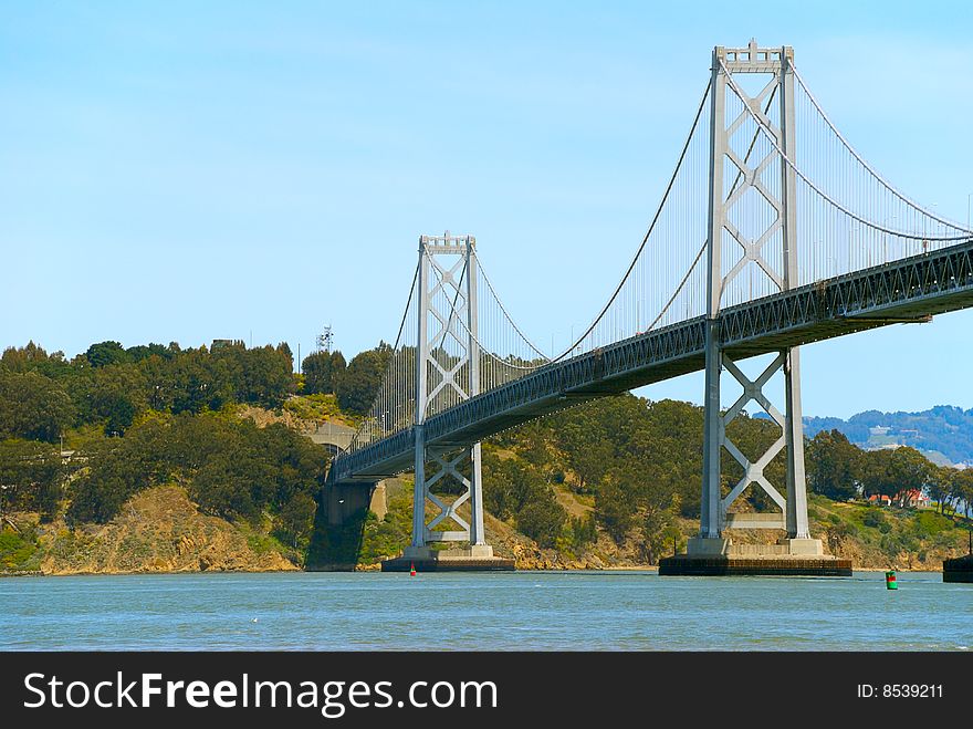 Bay bridge against blue sky background