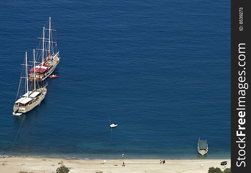 An aerial view of the beach and some boats. An aerial view of the beach and some boats